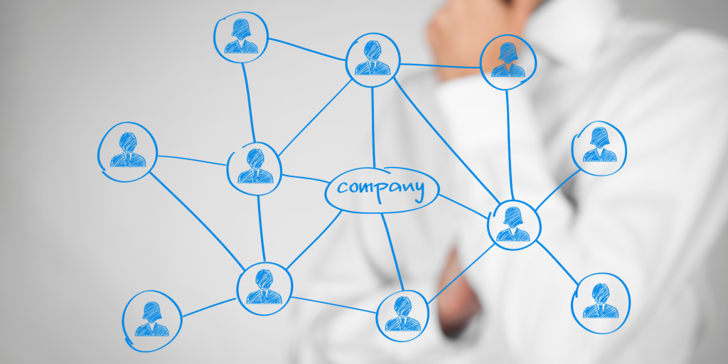 Illustration depicting a network of professionals connected to a company, visually representing the concept of 'what is staff augmentation' and its role in enhancing workforce flexibility and collaboration.