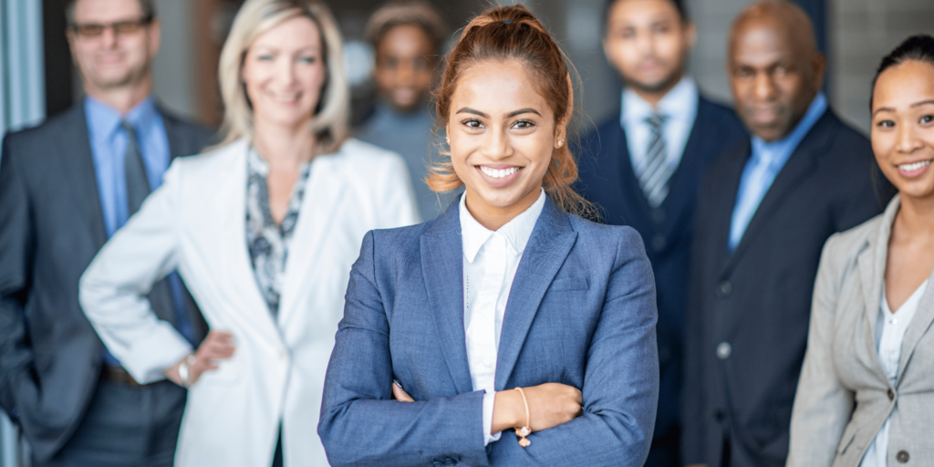 Professional team standing together, representing Staff Augmentation—empowering businesses with skilled talent to scale efficiently.